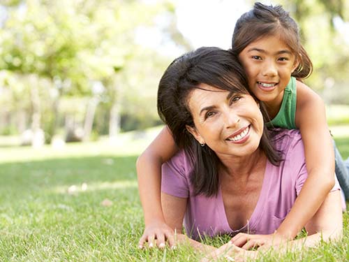 child hugging adult over shoulder