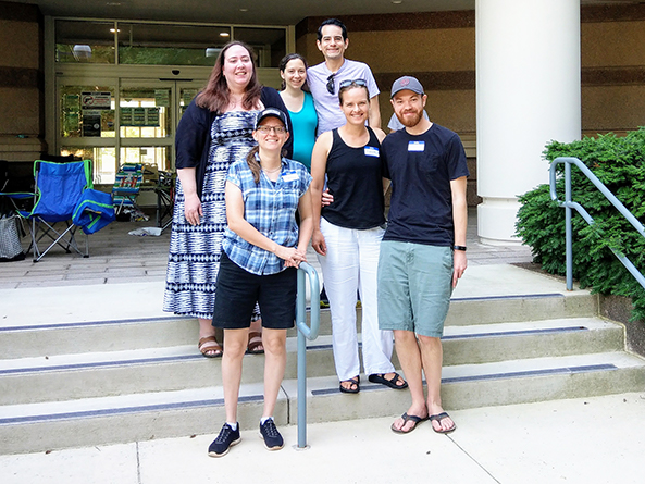 group of foster parents standing on steps