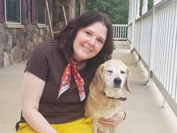 Julie Bowman hugging dog