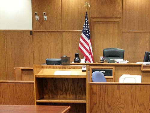 courtroom with one flag stand