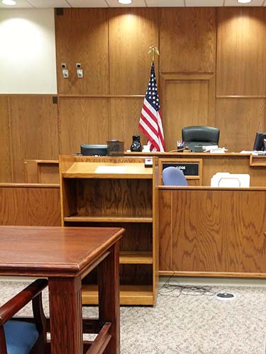 courtroom with one flag stand