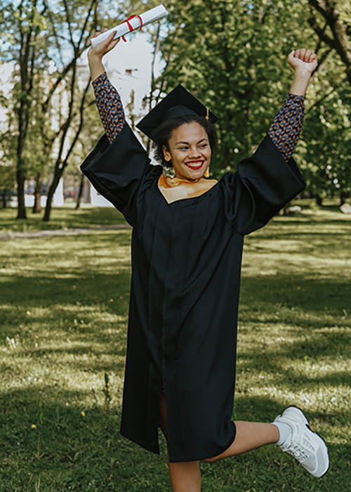 graduate with raised hands