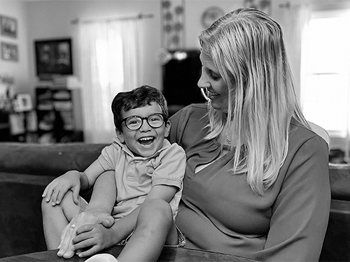 Katie holding a laughing Zak