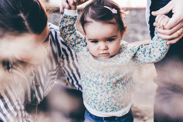 Woman walking with little girl