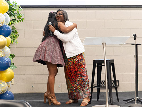 Foster Care Staff hugging youth