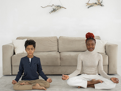 boy and woman meditating