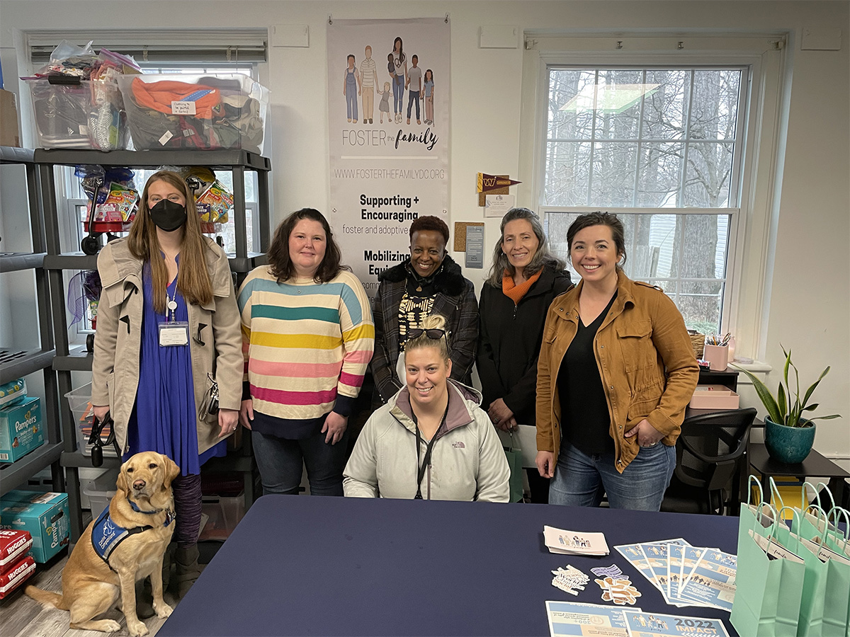 Foster the Family Visit: Group of six woman smiling with Rylynn 