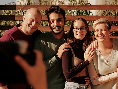 four people posing for a photo