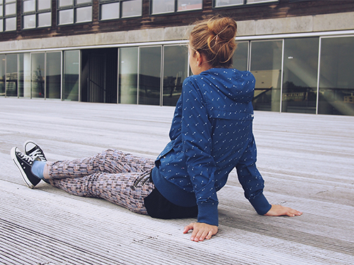 girl sitting outside looking away