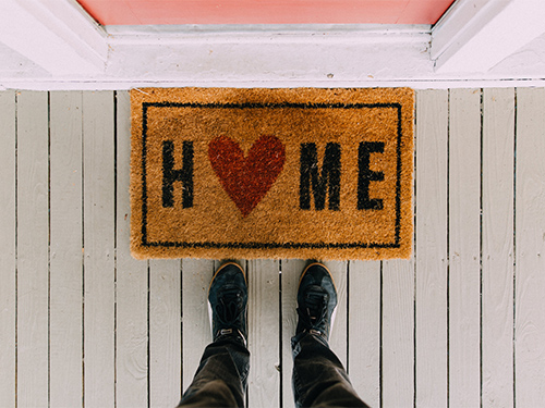 door mat that says home 