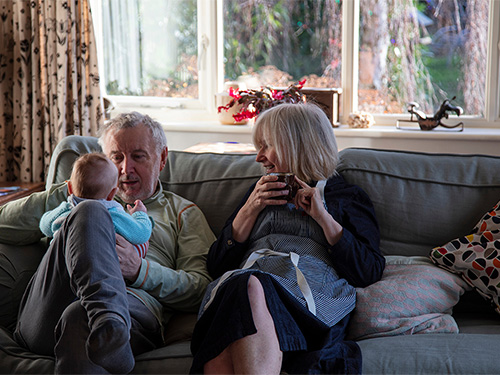 grandparents holding baby