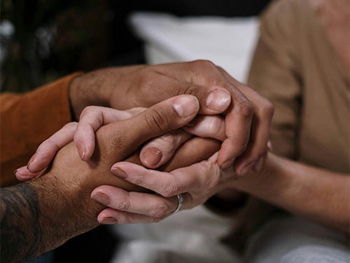 hands clasped in support