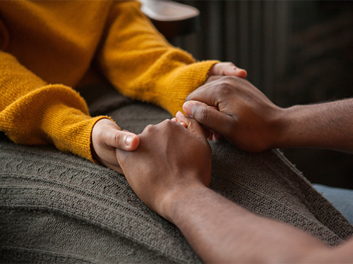 hands clasped in support