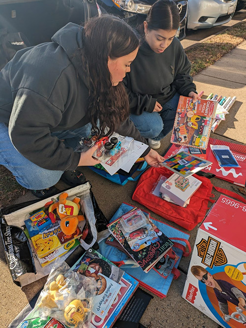 Harlee sorting donations