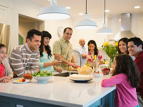 large family around kitchen island