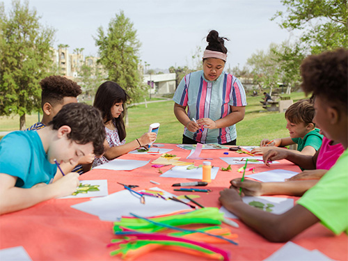 group of campers doing crafts 