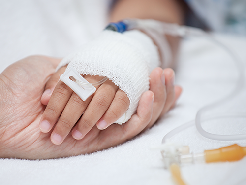 child's hand with IV