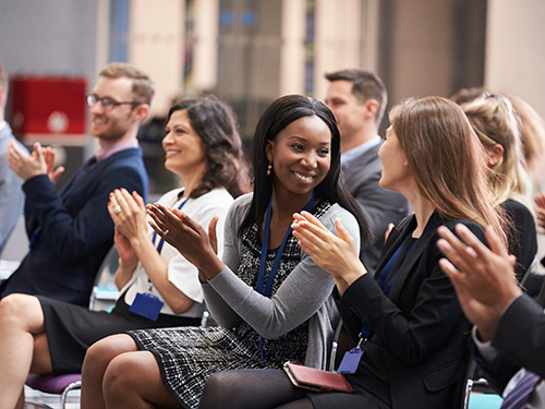 conference audience clapping