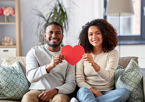 couple holding red heart