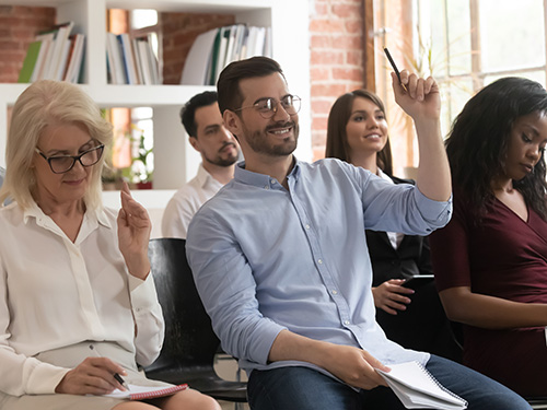 engaged man sitting in training group