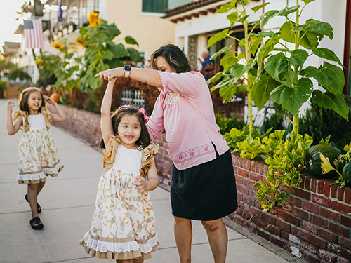 girls dancing with grandmother