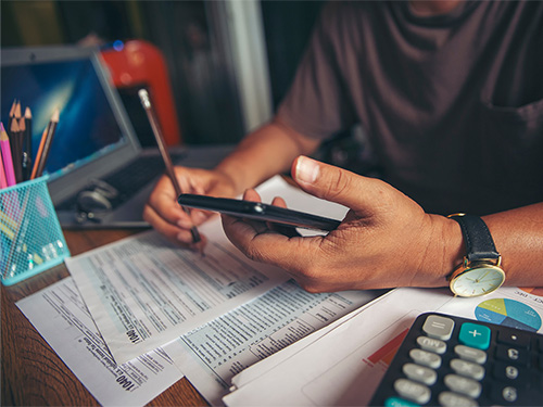 person calculating taxes