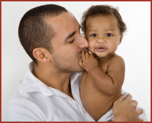 father-kissing-baby