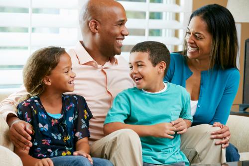 family of four on couch