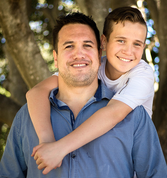 adult with child hugging outside