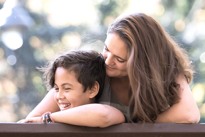 mother sitting with child smiling