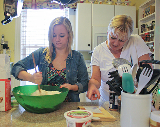 parent adn child baking in kitchen