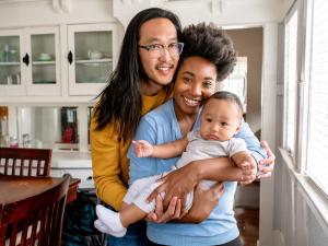 couple holding baby