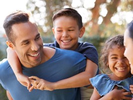 smiling family wearing blue