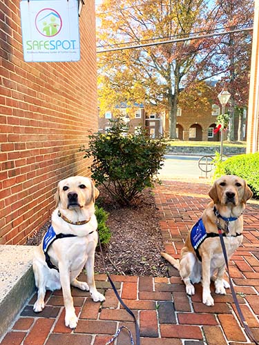 Rylynn and Virgil outside of SafeSpot office