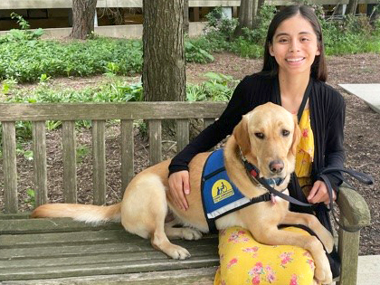 Rylynn sitting on a bench with Yesenia Soto-Guzman