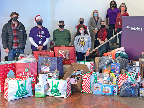 Leidos group photo with gifts