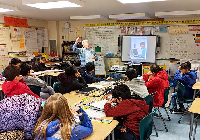 facilitator and children in classroom