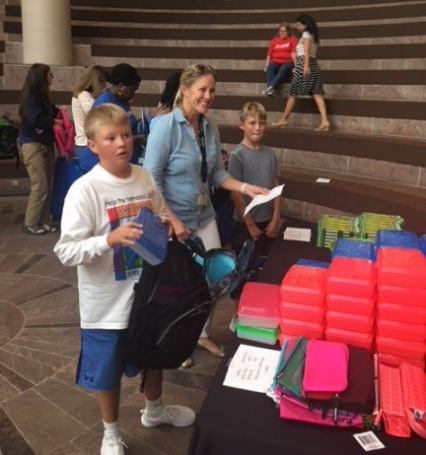 filling backpacks with supplies