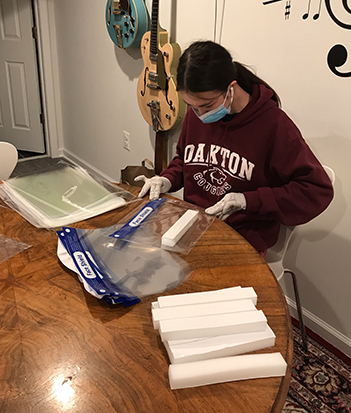 volunteer putting together supplies