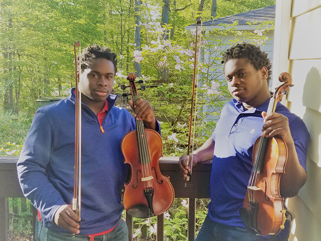 Ethan and Nathan holding instruments