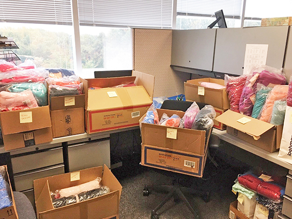 cubicle with boxes filled