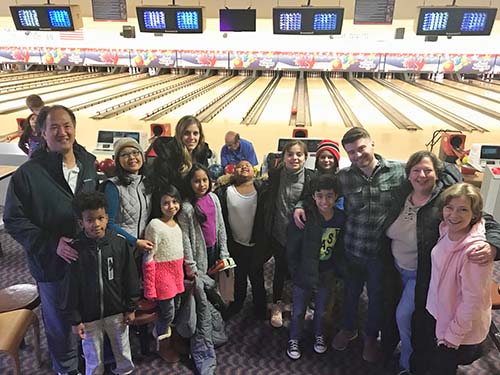 mentors and children at bowling alley
