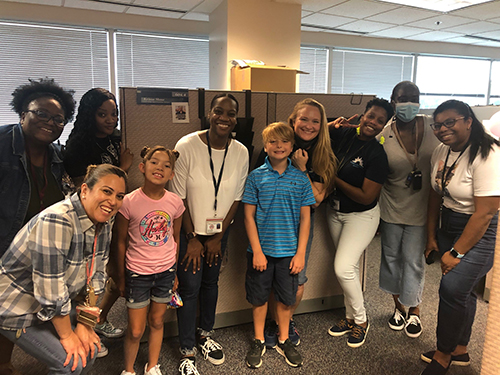 staff at backpack-filling event