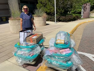 Woman with baby box donation