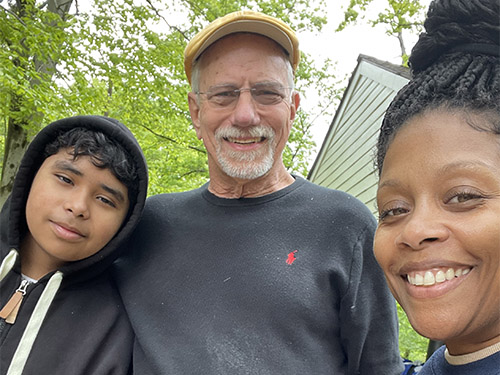 Tiffani smiling with man and boy