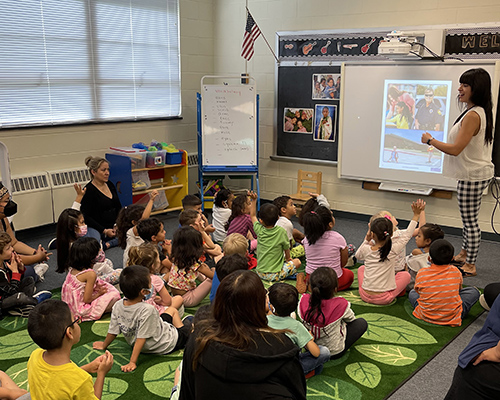 Woman teaching group of children