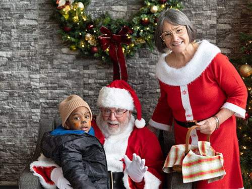 Boy with Santa and Mrs. Claus