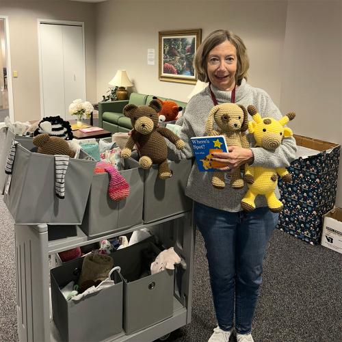 Rebecca Peek holding baby boxes