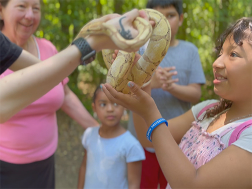 girl holding snake