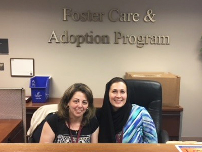 Administrative Assistant volunteers at reception desk